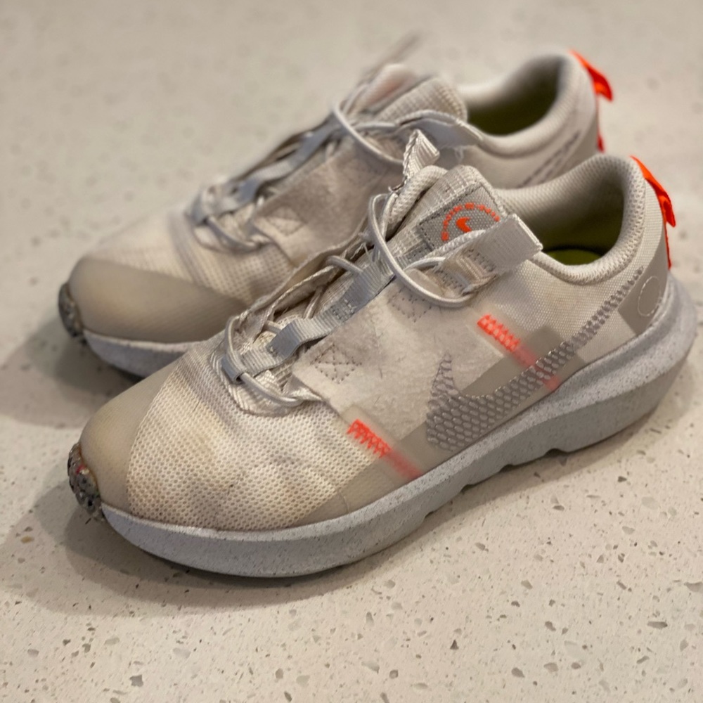 Girl’s White Nike’s with orange detail. size 1.5